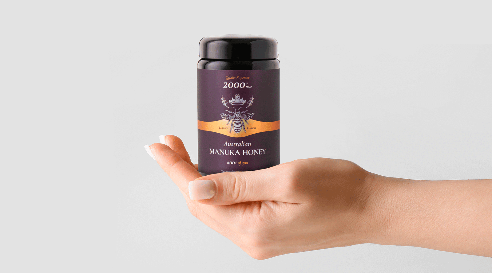 Woman holding jar of Manuka honey showcasing health benefits of Manuka honey
