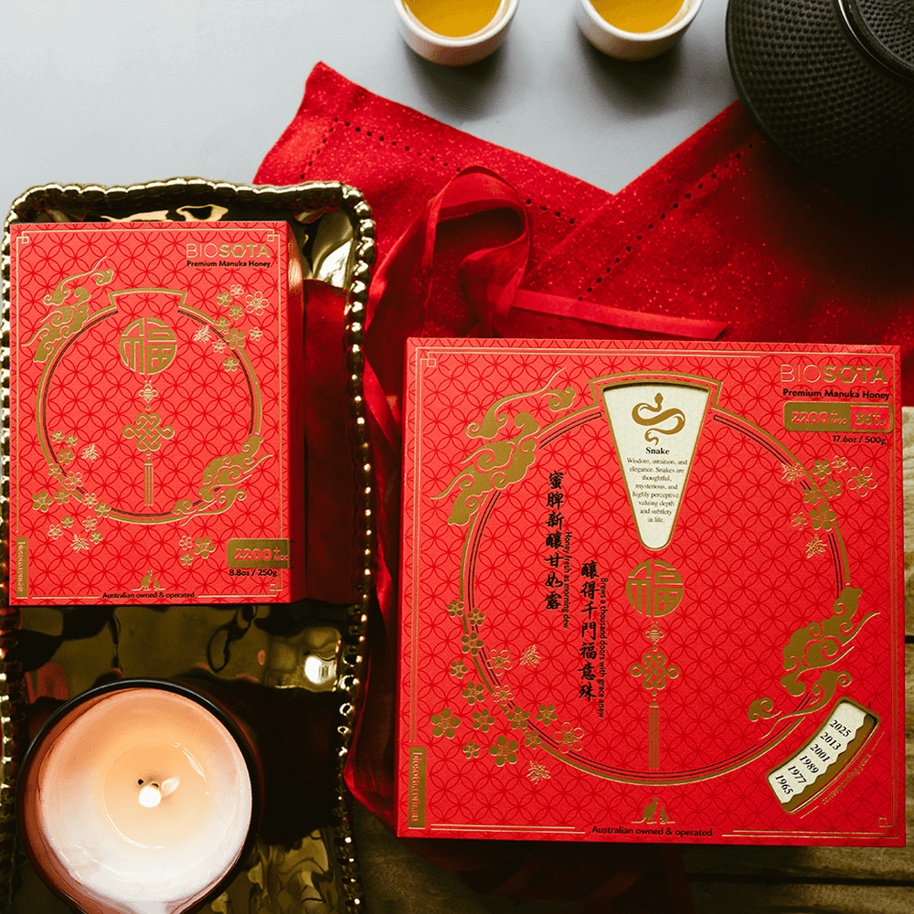 Premium Biosota Organics Manuka Honey MGO 2200+ 500g and 250g Lunar New Year luxury gift Box on table